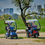 Afiscooter S Scooters Dual Seat And Single Seat With Canopies In Park. Afiscooter S Scooters Dual Seat And Single Seat With Canopies In Park.