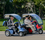 Blue And Red Recreational Scooters Outside. Blue And Red Recreational Scooters Outside.
