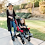 Woman pushing her little girl in Trotter Stroller Woman pushing her little girl in Trotter Stroller